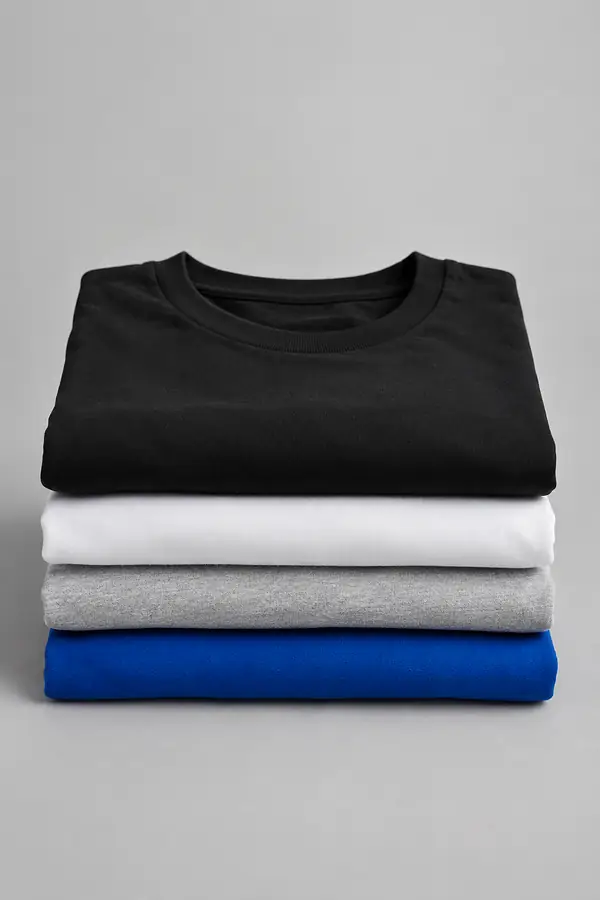 Stack of folded plain t-shirts in black, white, grey and blue